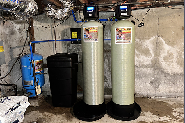 Complete well system inspection showing pump pressure tank and control systems for Alaska real estate transaction